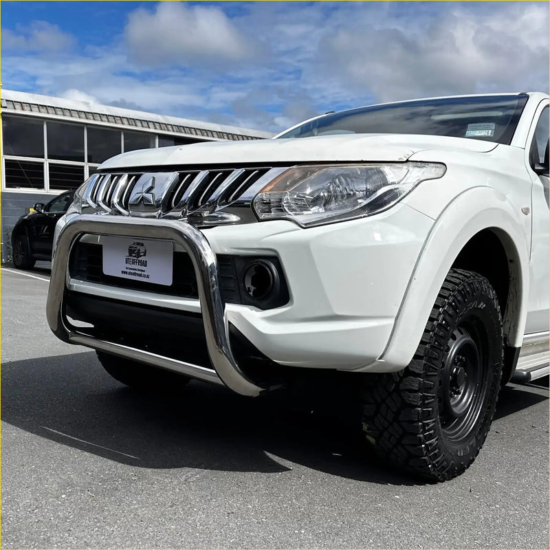 White mitsubishi triton pickup with chrome nudge bar compatible with front sensors 2005-2015 model