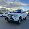 White mitsubishi triton with matte black nudge bar compatible front sensors black bumper guard and roof rack