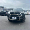 Black Toyota Hilux 2015-2025 with chrome nudge bar featuring compatible front sensors and a chrome bull bar