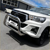 Shiny chrome nudge bar with compatible front sensors mounted on white toyota hilux 2015-2025