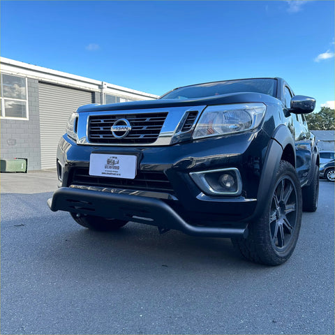 Black nissan navara pickup truck with chrome grille and black alloy wheels featuring a black nudge bar for np300 2015-2020