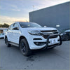 White holden colorado pickup with matte black nudge bar and black alloy wheels showing robust front bull bar
