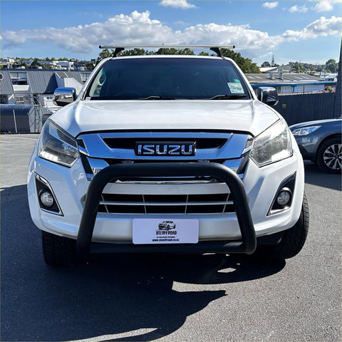 White isuzu d-max pickup with matte black nudge bar, black front bumper guard, and roof rack from 2012-2020