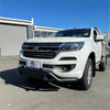 White holden colorado pickup truck with chrome grille and black front bumper featuring a nudge bar lower style