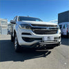White holden colorado pickup truck with chrome grille and black front bumper featuring a nudge bar lower style