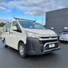 White toyota hiace 2019+ with chrome nudge bar, black front bumper guard, and roof rack visible from the front side