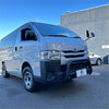 Silver toyota hiace van with matte black nudge bar and black front bumper guard with chrome accents