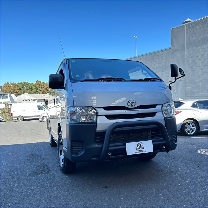 Silver toyota hiace narrow body van with matte black nudge bar guard and black side mirrors 2005-2019 model