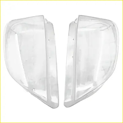 Clear transparent plastic bookends with smooth curved design shown with pair headlight lens cover kit for mercedes ml500