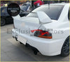 White mitsubishi lancer evolution rear view with prominent spoiler and black alloy wheels part for make model years sub model