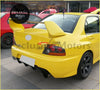 Bright yellow mitsubishi lancer evolution sports car with rear spoiler and black alloy wheels shown from the back side