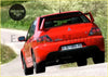 Back side of vibrant red mitsubishi lancer evolution with sporty rear spoiler and distinctive taillights part for model years sub model