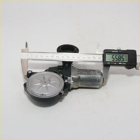 Silver and black toyota power window motor measured at 5.585 inches for hilux 2004-2016 and toyota models like camry and corolla