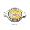 Silver radiator coolant reservoir cap with yellow warning label for toyota kf40 kf50 visible from the back side