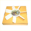 White plastic radiator cooling fan blade with metallic hub resting on orange box for nissan navara pathfinder 86-89
