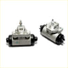 Silver metal rear brake cylinder with black rubber seals and threaded fittings for nissan largo 4wd 1993-1999