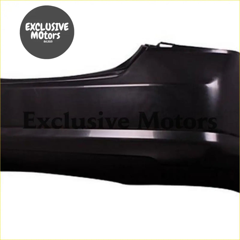 Black plastic rear bumper for nissan tiida sedan 2005-2006 with exclusive motors embossed in matte finish backside view