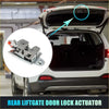 Silver metallic rear liftgate door lock actuator with red button installed on white toyota tacoma trunk back side