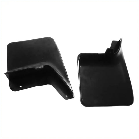 Black plastic rear mud flaps with molded contours and mounting holes for nissan navara d22 1997-2004 shown from back side