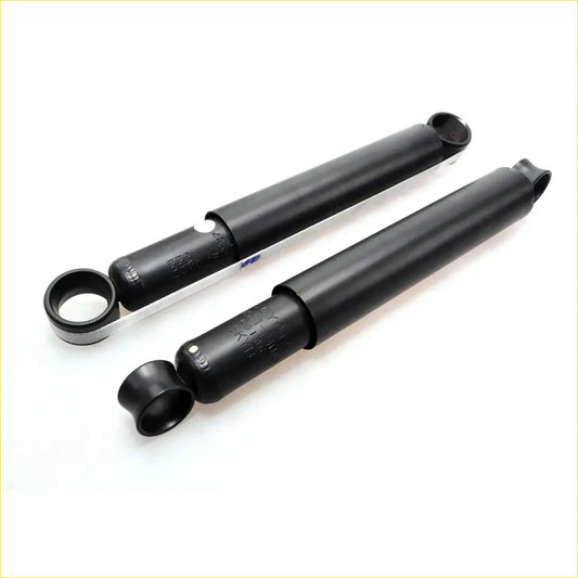 Rear shock absorber for toyota hilux 1997-2005 black cylindrical with metallic ends and engraved markings shown from the back