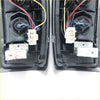 Black plastic rear tail light assemblies with white electrical connectors for nissan datsun navara d22 backside view
