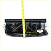 Black plastic rear tail light assembly for nissan navara d22 1998-2004 with visible wiring and connectors backside view