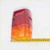 Rear tail light lens for Nissan Datsun 720 1980-1989 with red and amber dual-section textured lens back view