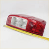 Rear tail light x2 for Nissan Navara D40 2005-2012 showing red plastic with clear lens and textured pattern back side