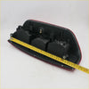Rear tail light x2 for nissan navara d40 2005-2012 showing black and red plastic molded housing back side