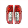 Rear tail light x2 for nissan navara d40 2005-2012 red plastic with clear lens and multiple led bulbs shown from back
