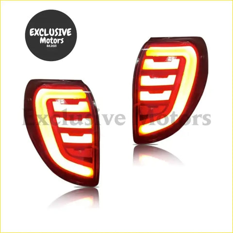 Red and yellow led rear tail lights with sleek horizontal strips for toyota rav4 2009-2012 back side view