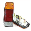 Rear tail lightset for nissan datsun 720 with orange and red lens and clear bottom lens in silver metal housing