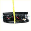 Back view of black plastic rear tail lightset with wiring and connectors for nissan navara d22 ute terrano 1998-2004