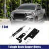 Black rear tailgate assist shock lift support strut with silver metal ends and hardware for 4wd ute offroad use