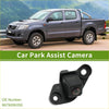 Black plastic rear view backup camera with mounting brackets and lens for toyota hilux 2021-2024 shown from back