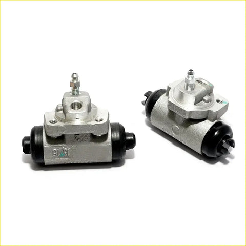 Silver metal rear wheel brake cylinder with black rubber seals and threaded fittings for nissan violet 1986-1990