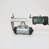 Silver metal rear wheel brake cylinder with black rubber caps and stamped logo for nissan datsun 720 d21 80-86
