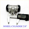 Silver metal rear wheel brake cylinder with black rubber caps measured by digital caliper for nissan navara d23 np300