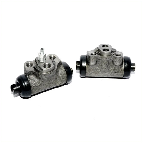Gray metallic rear wheel brake master cylinder with black rubber end caps and threaded fittings for mitsubishi pajero montero 1983-1991