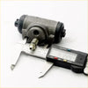 Rear wheel brake cylinder set for mitsubishi triton l200 with gray metal body black rubber caps and threaded rod