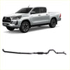 Silver toyota hilux with black alloy wheels and matching aftermarket redback extreme duty exhaust system shown from back side