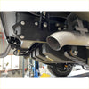 Black metal undercarriage bracket with silver bolts and curved stainless steel exhaust pipe on redback extreme duty twin 4 inch exhaust for toyota landcruiser 79 series