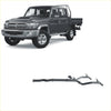 Dark gray toyota land cruiser 70 pickup with chrome grille silver wheels and redback extreme duty twin exhaust system