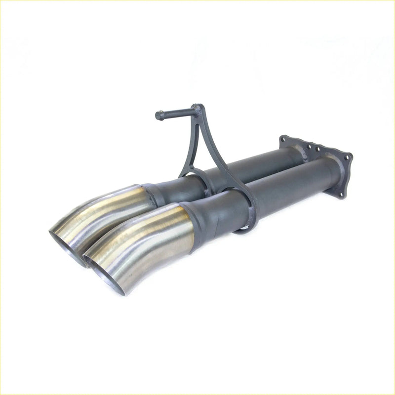 Back side of redback muffler delete dual exhaust system with polished stainless steel tips and black tubing for landcruiser