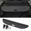 Black fabric trunk liner with textured surface and handle for retractable cargo cover in toyota c-hr rear boot shelf