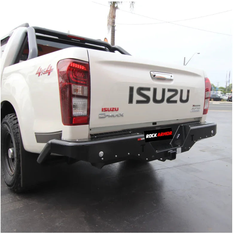 White Isuzu D-Max pickup truck with rear step and tow bar featuring Rockamor Elite Steel Rear Step Towbar