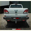 Rear view of black steel rockarmor elite rear step bumper with red accents and towbar on white mazda bt50 4wd ute