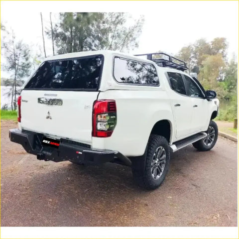 White mitsubishi triton ute with rockamor elite steel rear step towbar black bumper perfect for 4wd offroad use