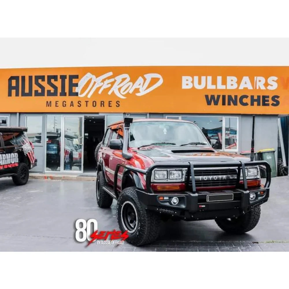 Red Toyota Land Cruiser with Rockarmor Brush Bars and Bull Bar for 100/105/80/120/200 models