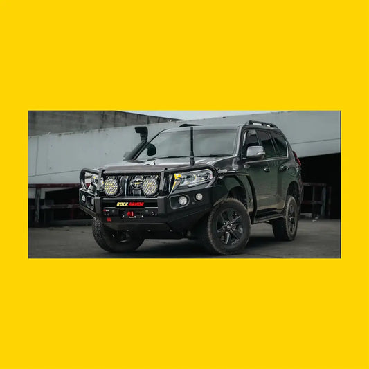 Black toyota land cruiser prado with rockarmor brushbar front bumper and off-road lights for tough adventures